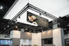 Exhibition stand with 'Spring Cafe' branded banner at a trade show