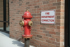 fire department connection sign on wall