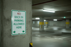 No back in parking allowed sign in a dimly lit underground parking garage
