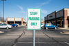 Staff parking only sign on sign post
