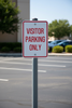 visitor parking on sign post