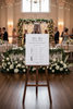 Wedding timeline sign black and white on an easle