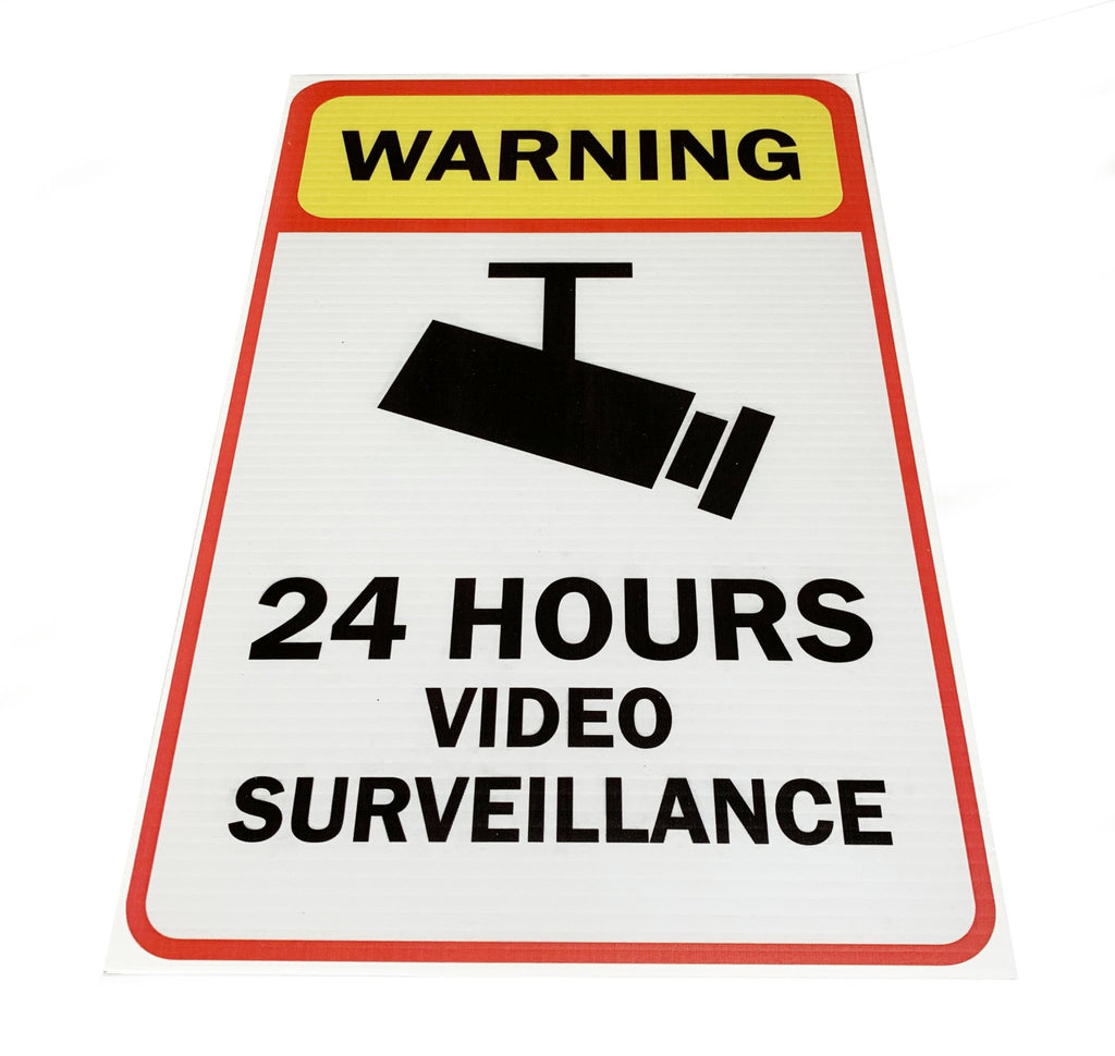 Generic CCTV in Operation Warning Sign on Bushes Fence Stock Image Generic CCTV in Operation Warning Sign on Bushes Fence Stock Image